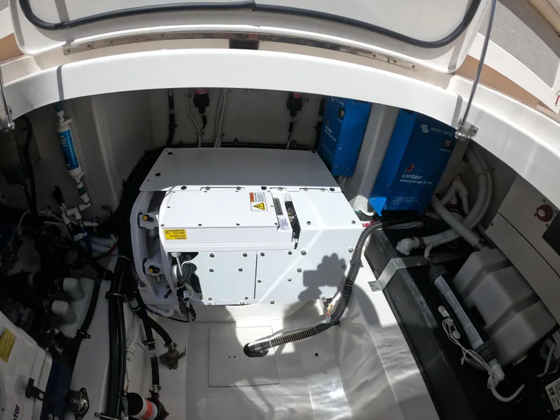 Slide: The Image of Engine compartment of 2024 Tiara Yachts 43 LS, showcasing mechanical components and systems. - 24