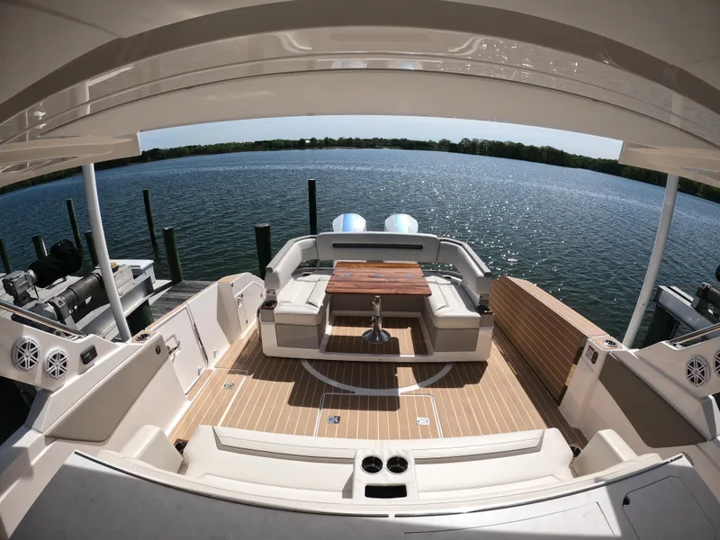 Slide: The Image of 2024 Tiara Yachts 43 LS luxury yacht with spacious deck and scenic water view. - 7