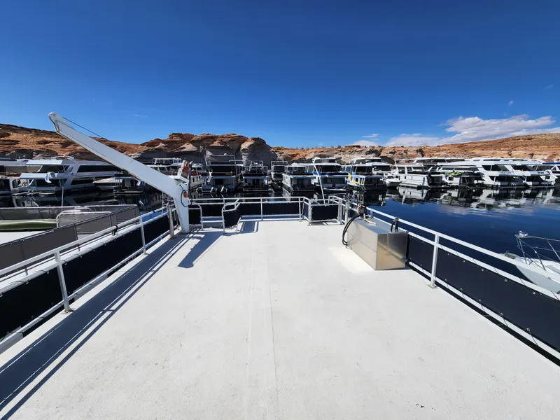 Slide: The Image of Rooftop deck of 2004 Skipperliner Inn Conspicuous Share, overlooking marina with clear blue sky. - 24