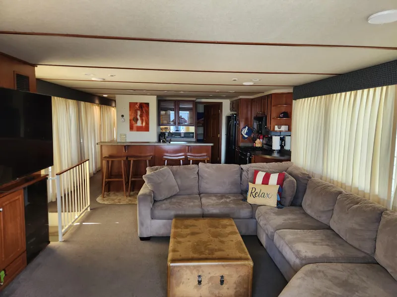 Slide: The Image of Spacious 2004 Skipperliner houseboat interior with cozy seating and modern kitchen. - 4