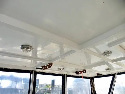 Slide: The Image of Interior ceiling of a 1984 Ponderosa 42 boat with lights and windows. - 11