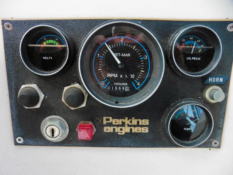 Slide: The Image of Dashboard of a 1984 Ponderosa 42 with Perkins engine gauges and controls. - 15
