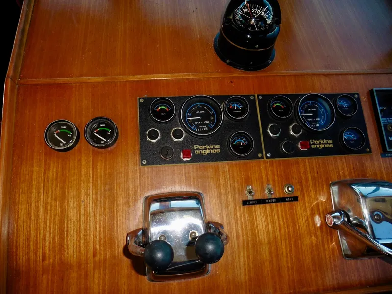 Slide: The Image of Control panel of a 1984 Ponderosa 42 boat with Perkins engines gauges. - 31