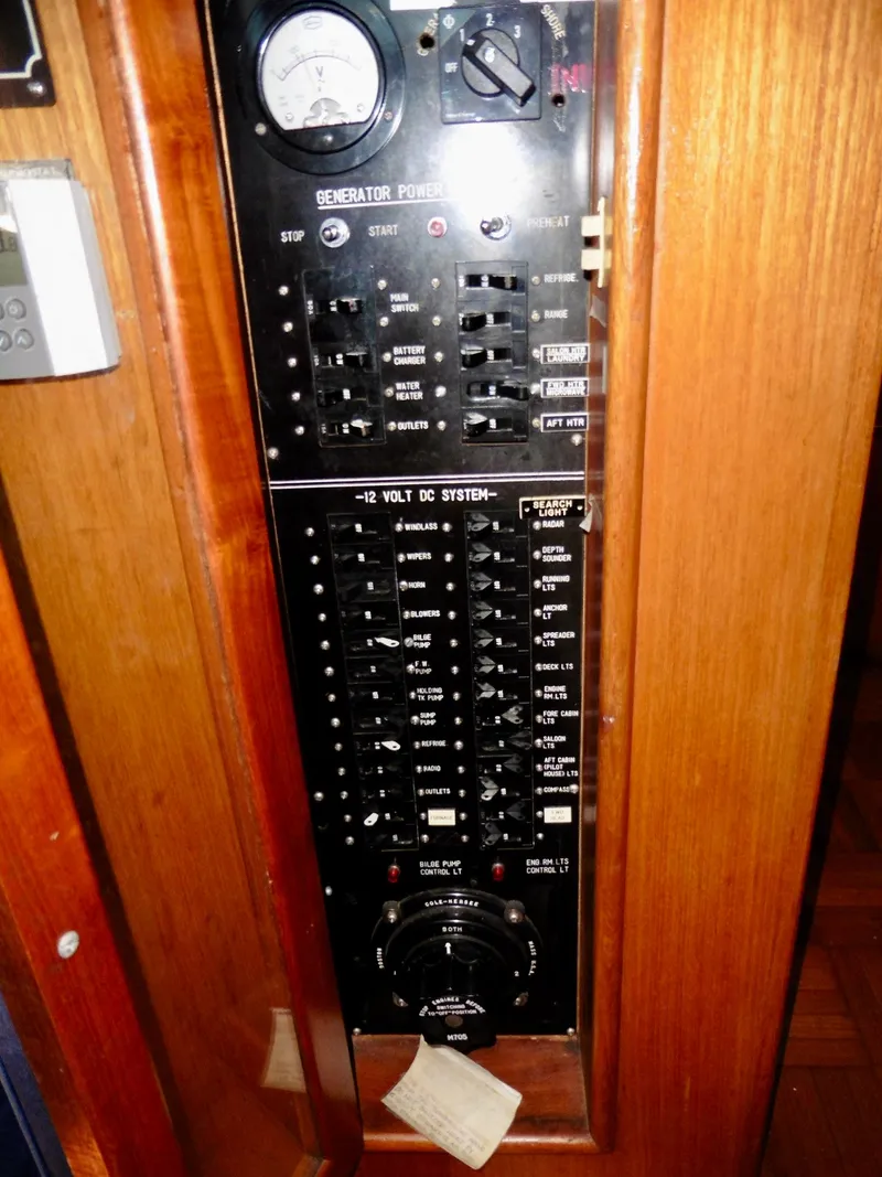 Slide: The Image of Electrical control panel on a 1984 Ponderosa 42 boat, featuring switches and gauges. - 33
