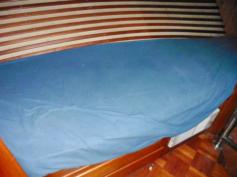 Slide: The Image of Wooden boat interior with blue-covered bench, Ponderosa 42, 1984 model. - 45