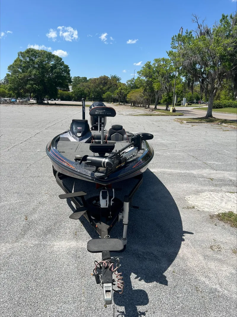 Slide: The Image of 2019 Skeeter ZX225 boat parked on a sunny day in an open lot. - 12