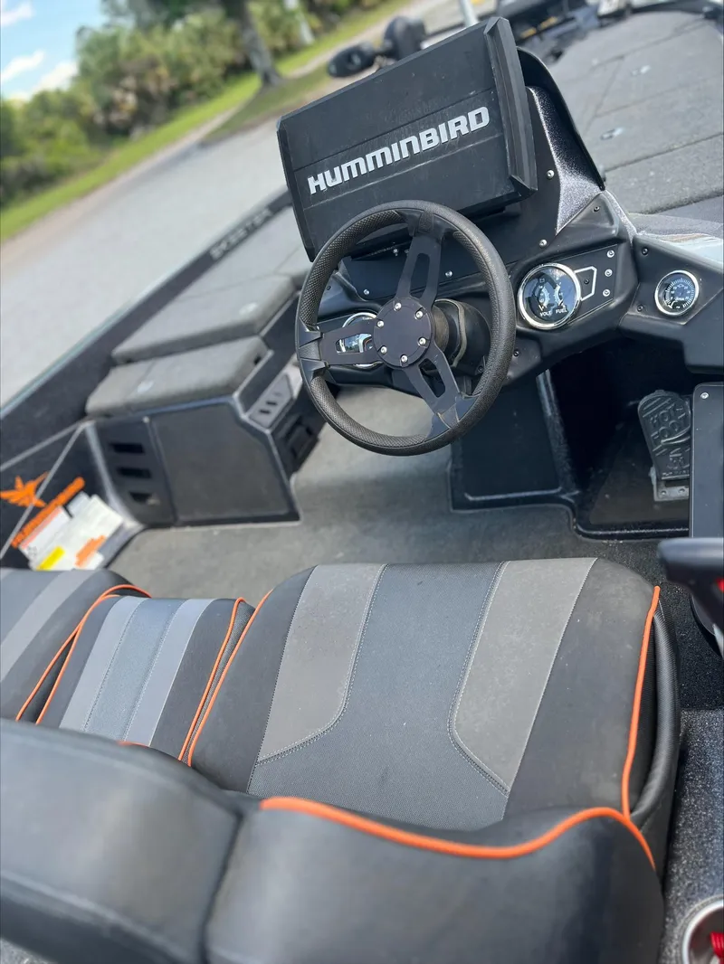 Slide: The Image of 2019 Skeeter ZX225 boat interior with Humminbird electronics and sleek seating. - 5