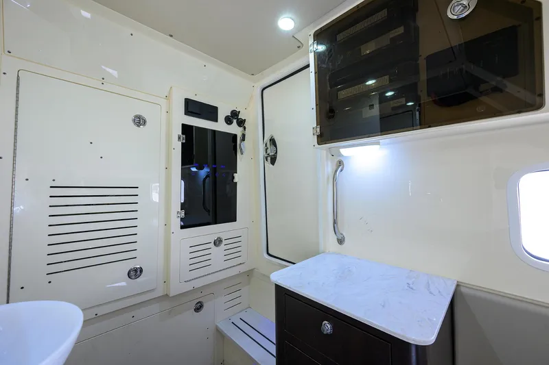 Slide: The Image of 2023 Scout 355 LXF cabin interior with modern cabinetry and sleek design. - 36