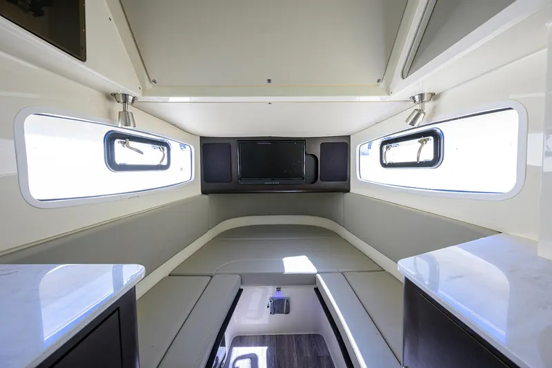 Slide: The Image of Interior cabin of 2023 Scout 355 LXF boat with modern design and windows. - 37