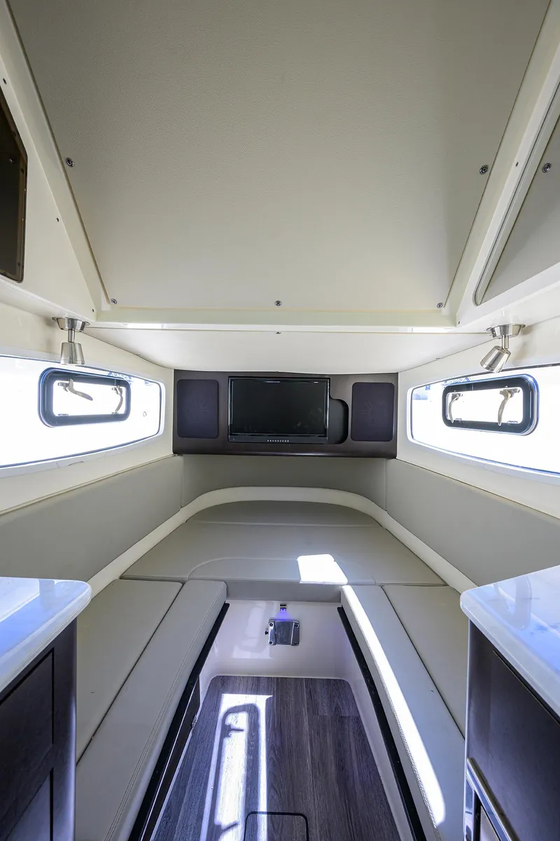 Slide: The Image of 2023 Scout 355 LXF cabin interior with modern design and built-in TV. - 38