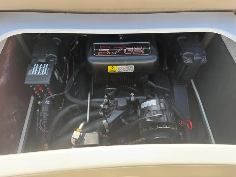 Slide: The Image of 1998 Four Winns 240 Horizon engine compartment with 5.7 GSi engine visible. - 8