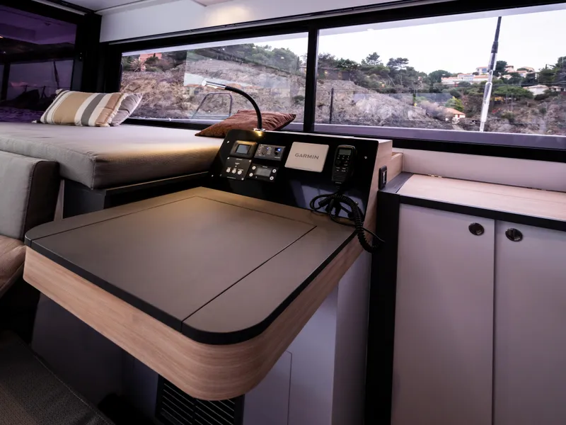 Slide: The Image of 2026 Windelo 50 Adventure yacht interior with navigation station and scenic window view. - 27