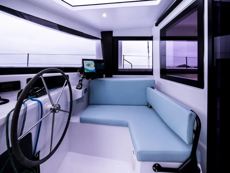 Slide: The Image of Interior of 2026 Windelo 50 Adventure yacht with modern helm and seating area. - 29