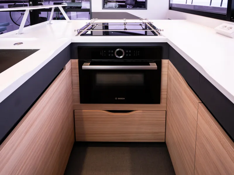 Slide: The Image of Modern kitchen in 2026 Windelo 50 Adventure yacht with sleek appliances and wood cabinetry. - 19
