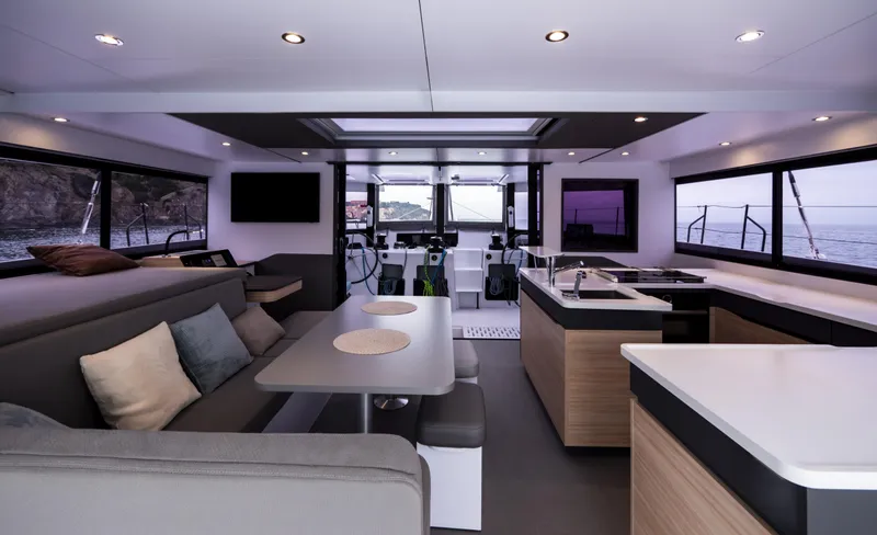 Slide: The Image of Luxurious interior of 2026 Windelo 50 Adventure yacht with modern kitchen and seating area. - 23