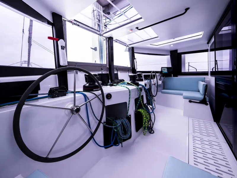 Slide: The Image of Interior of 2026 Windelo 50 Adventure yacht, featuring modern helm and seating area. - 28