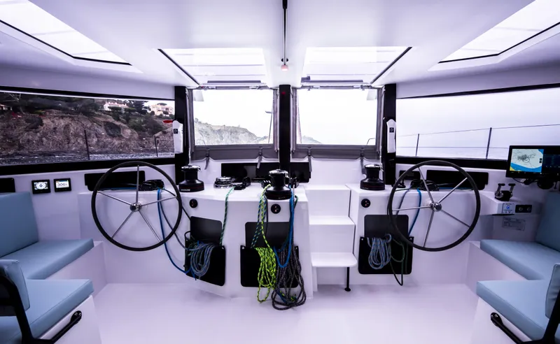 Slide: The Image of Interior of 2026 Windelo 50 Adventure yacht cockpit with dual steering wheels. - 31