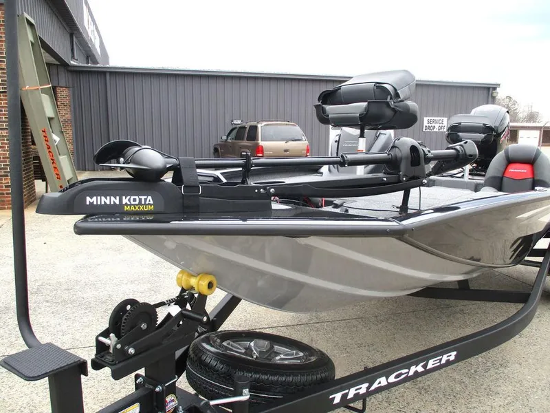 Slide: The Image of 2025 Tracker Pro Team™ 195 Tournament Edition boat on trailer with Minn Kota Maxxum motor. - 6