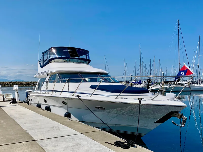 Slide: The Image of Luxurious Prima 5230 yacht interior with elegant wood finish and lake view, 1999 model. - 11