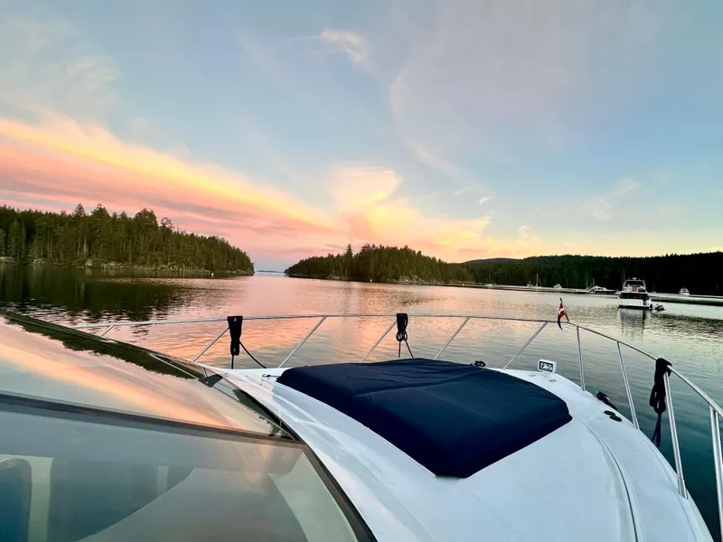 Slide: The Image of Luxury Prima 5230 yacht docked at marina, clear blue sky, 1999 model. - 13