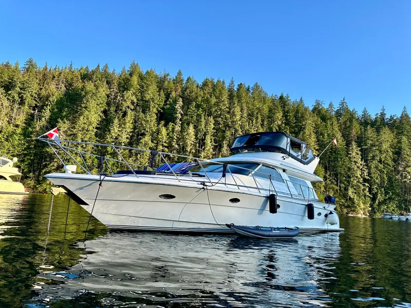 Slide: The Image of Boat approaching a large suspension bridge under a clear blue sky. - 14