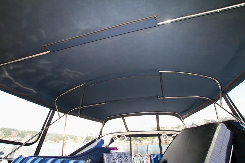 Slide: The Image of Interior view of a 1999 Prima 5230 yacht with marina backdrop. - 23