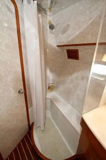 Slide: The Image of Interior of a 1999 Prima 5230 yacht with modern staircase and luxurious seating. - 28