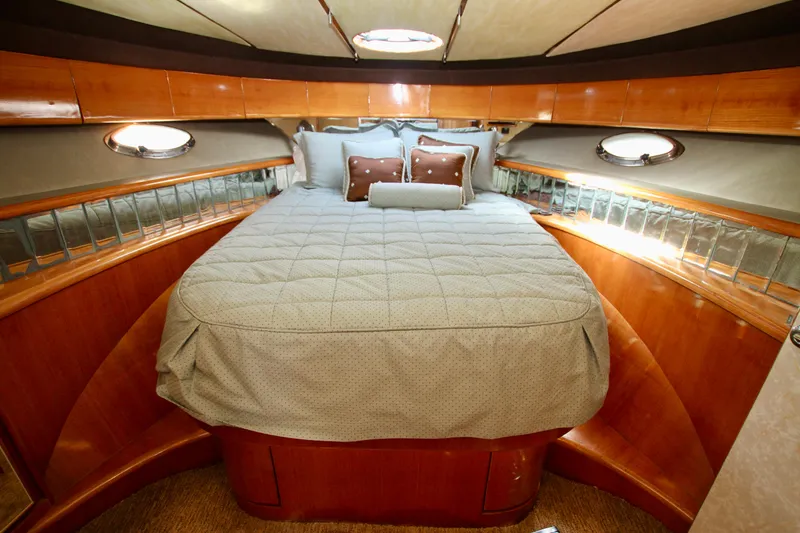Slide: The Image of Luxurious cabin interior of 1999 Prima 5230 yacht with cozy bed and elegant decor. - 36
