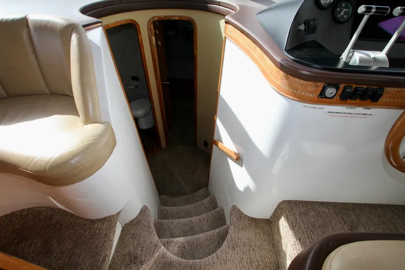 Slide: The Image of Interior of a 1999 Prima 5230 yacht with wooden doors and carpeted hallway. - 42