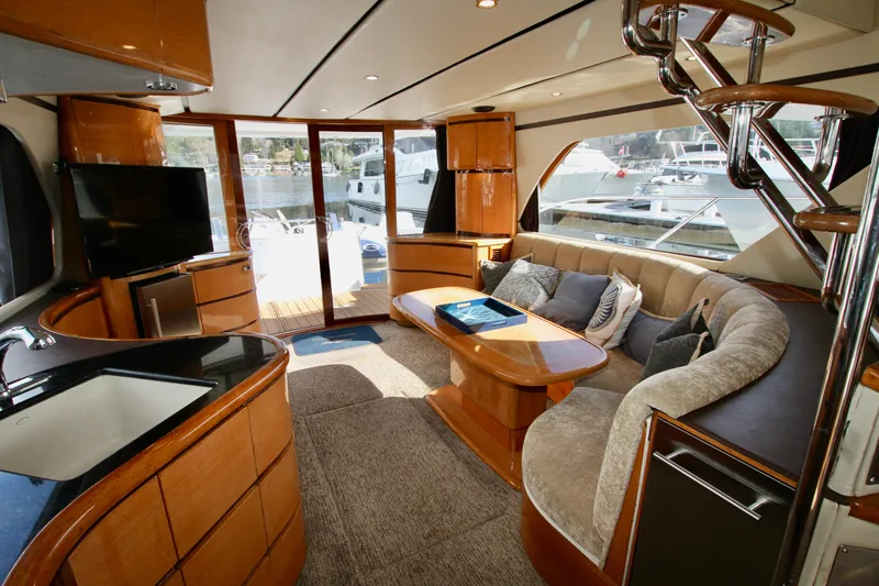Slide: The Image of Luxurious interior of a 1999 Prima 5230 yacht with modern furnishings and elegant design. - 49