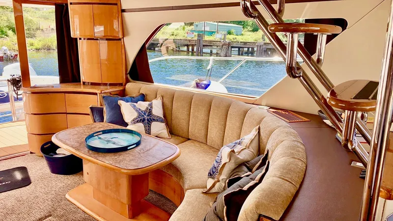 Slide: The Image of Twin beds in a 1999 Prima 5230 yacht cabin with cozy lighting. - 7