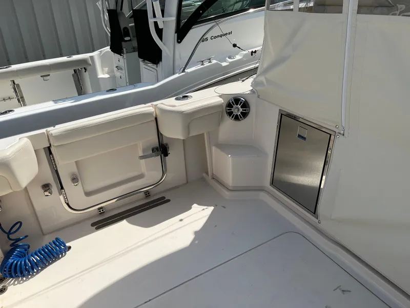 Slide: The Image of 2023 Grady-White Express 330 boat interior with seating and storage compartments. - 16
