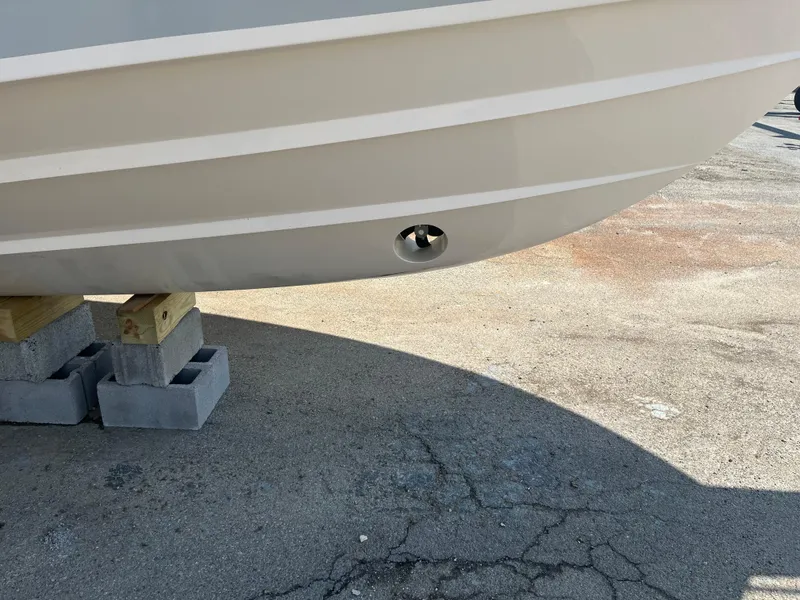 Slide: The Image of 2023 Grady-White Express 330 boat hull on blocks, showing bottom detail. - 3