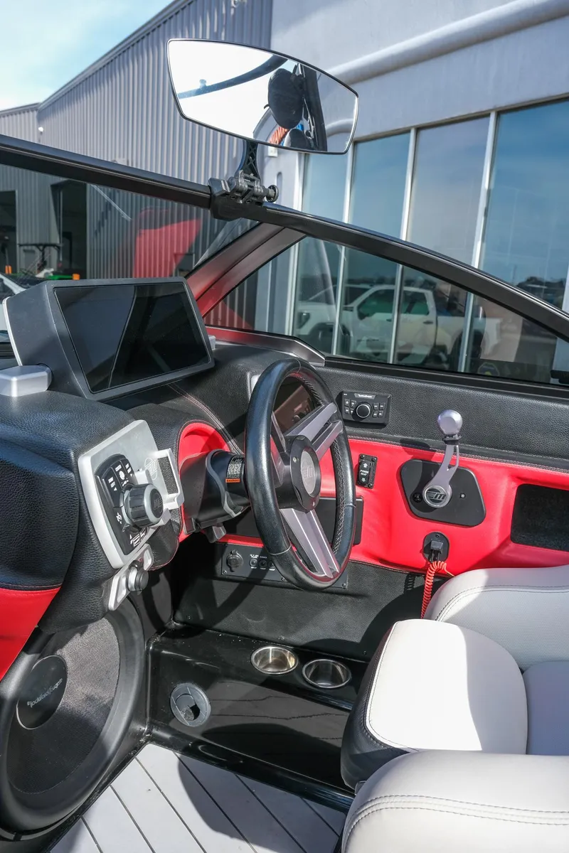 Slide: The Image of 2017 Malibu Wakesetter 22 MXZ boat interior with modern dashboard and steering wheel. - 13