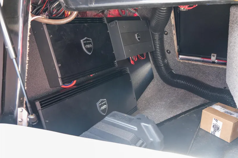 Slide: The Image of 2017 Malibu Wakesetter 22 MXZ interior showing audio system components and wiring. - 26