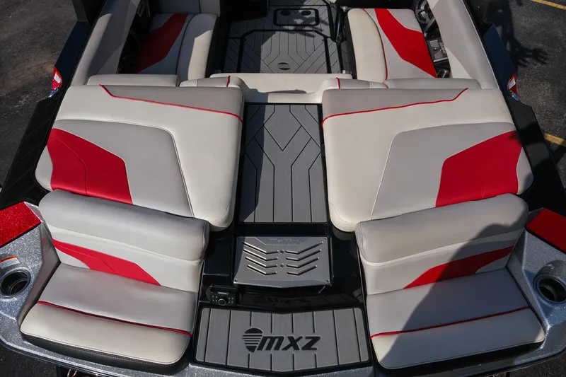 Slide: The Image of 2017 Malibu Wakesetter 22 MXZ boat interior with red and gray seating. - 28