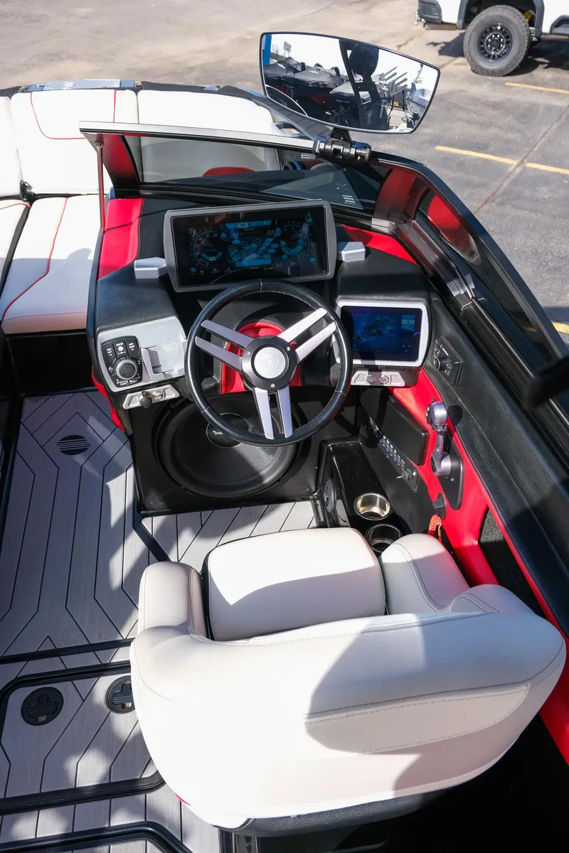 Slide: The Image of 2017 Malibu Wakesetter 22 MXZ boat cockpit with modern controls and steering wheel. - 30