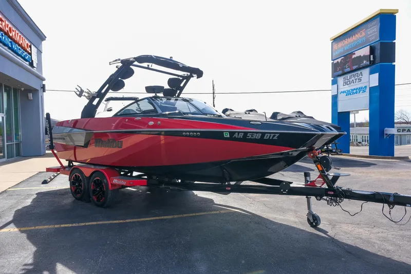 Slide: The Image of 2017 Malibu Wakesetter 22 MXZ boat on trailer, parked outside dealership. - 8