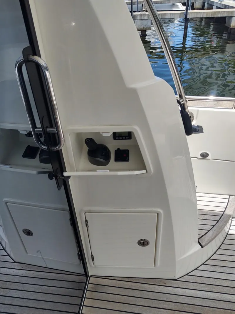 Slide: The Image of 2020 Prestige 520S yacht exterior detail with control panel and sleek design. - 11