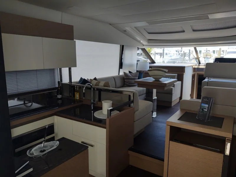 Slide: The Image of Luxurious interior of a 2020 Prestige 520S yacht with modern kitchen and seating area. - 16