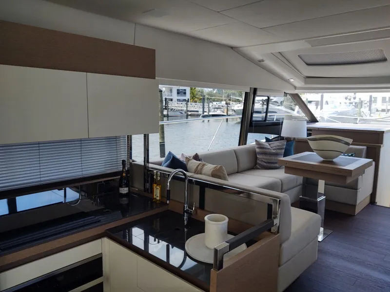 Slide: The Image of Luxurious interior of a 2020 Prestige 520S yacht with modern kitchen and seating area. - 18
