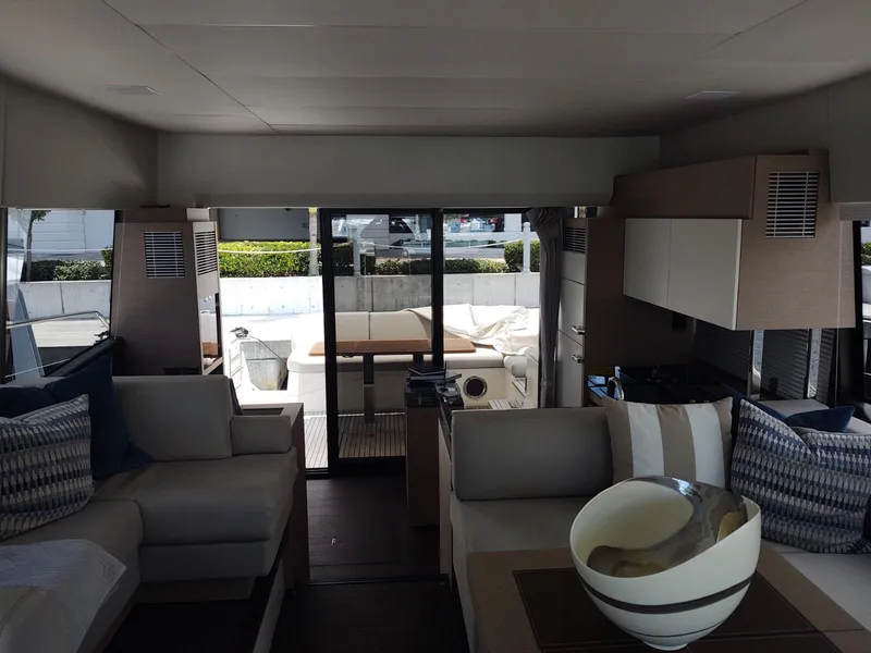 Slide: The Image of Interior of 2020 Prestige 520S yacht, featuring modern seating and elegant decor. - 23