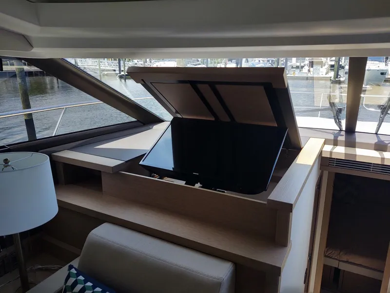 Slide: The Image of 2020 Prestige 520S yacht interior with retractable TV and modern design. - 25