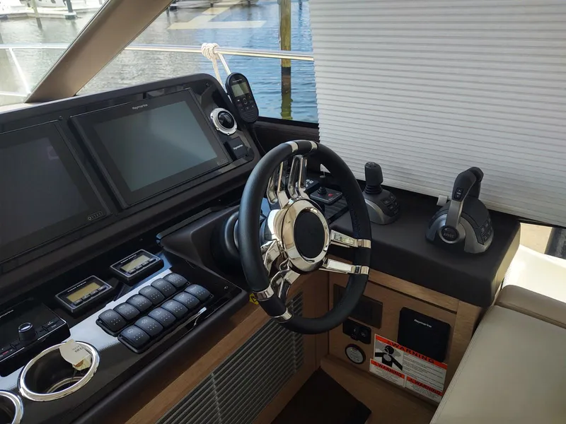 Slide: The Image of Helm of 2020 Prestige 520S yacht with modern controls and navigation systems. - 27