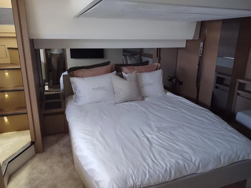 Slide: The Image of Luxurious bedroom interior of a 2020 Prestige 520S yacht with elegant bedding and modern design. - 30