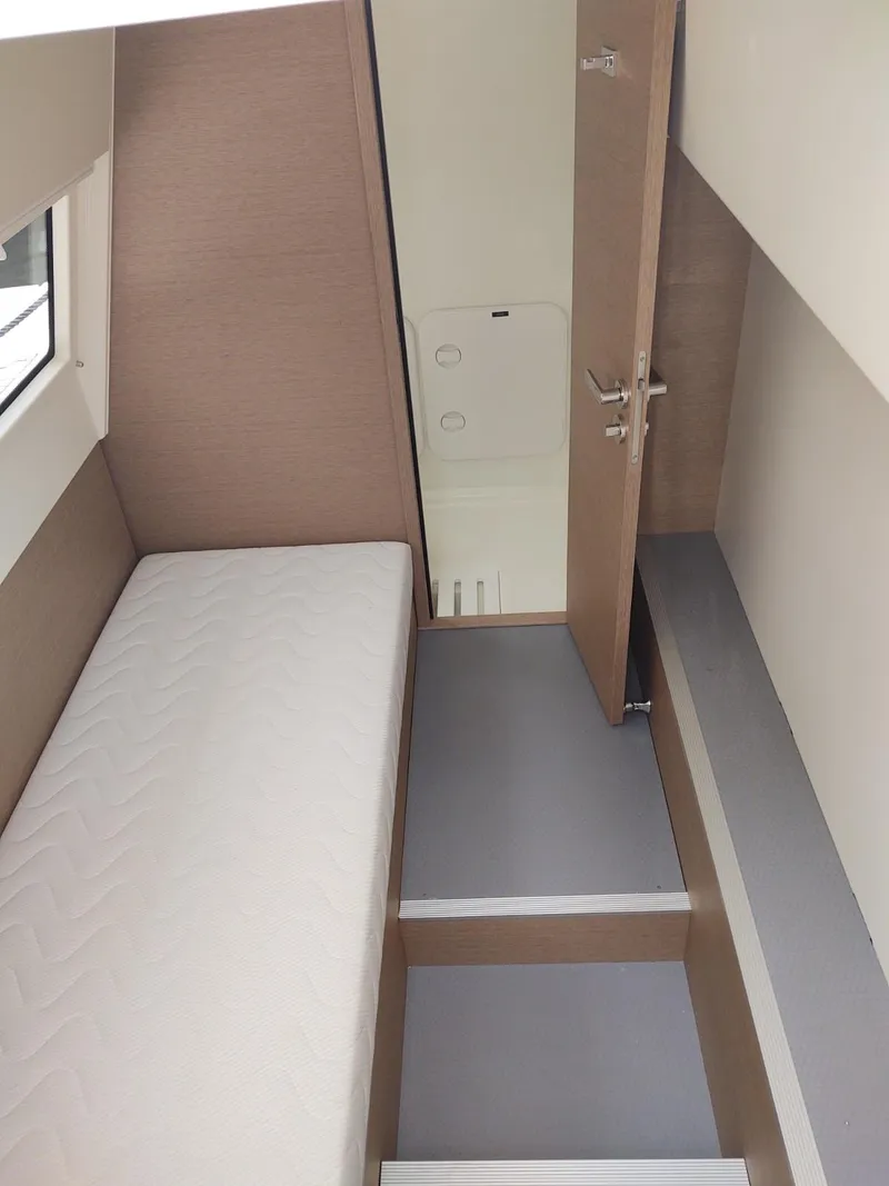 Slide: The Image of Interior of 2020 Prestige 520S yacht cabin with bed and open door. - 40