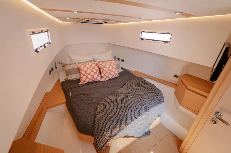 Slide: The Image of Luxurious cabin interior of 2022 Pardo Yachts 38, featuring a cozy bed and modern design. - 14