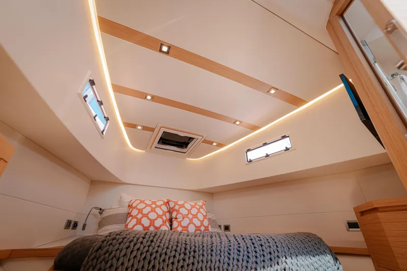 Slide: The Image of Luxurious cabin interior of 2022 Pardo Yachts 38 with modern lighting and cozy bedding. - 19