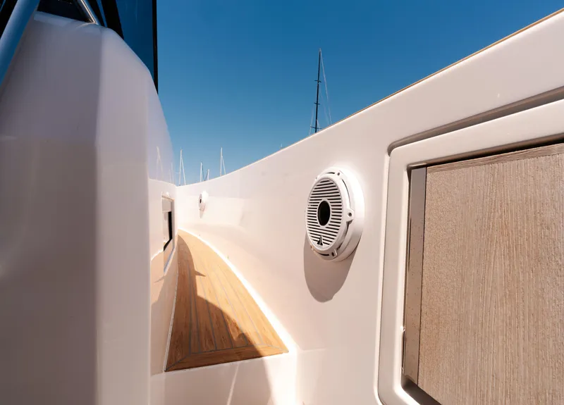 Slide: The Image of Pardo Yachts 38 (2022) deck view with speaker and wooden paneling. - 21