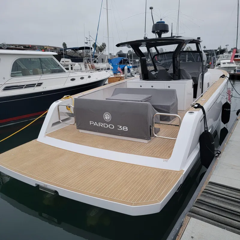 Slide: The Image of 2022 Pardo Yachts 38 docked, showcasing sleek design and spacious deck. - 26